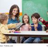 Children And Teacher Playing With Musical Instruments
