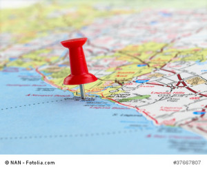 Clouseup of red pushpin on the map