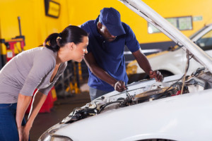 young woman sending her car for repair